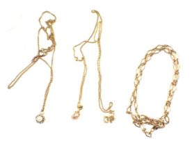 Three various yellow metal pendants and chains, comprising a pink cultured pearl and tiny diamond se