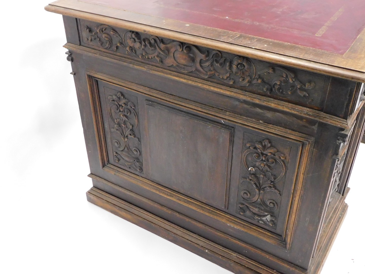 A Continental carved oak pedestal desk, the rectangular top with an ox blood red leatherette inset, - Image 3 of 6