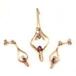 A 9ct gold pendant and earring set, the Art Nouveau style pendant set with garnet, topaz, citrine an