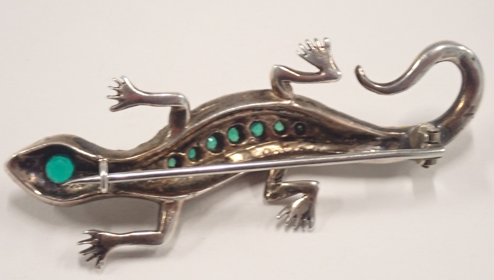 A 1950s lizard brooch, set with arrangement of green, white and red paste stones, in white metal set - Image 3 of 3