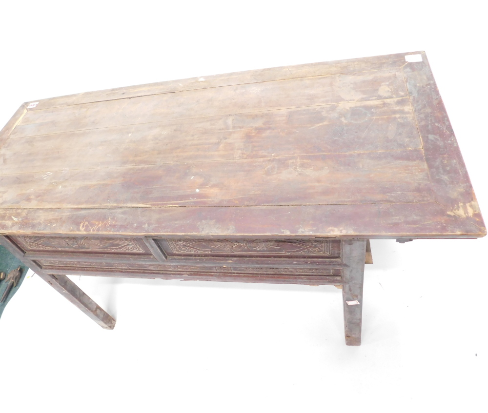 A Chinese red stained altar table, with rectangular planked top above two short drawers, on plain su - Image 2 of 2