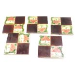 Five Art Nouveau ceramic wall tiles, each of four sectional box design, with treacle panels and pink