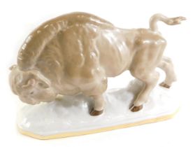 A Russian porcelain model of a bison, on a rectangular base, 23cm wide.