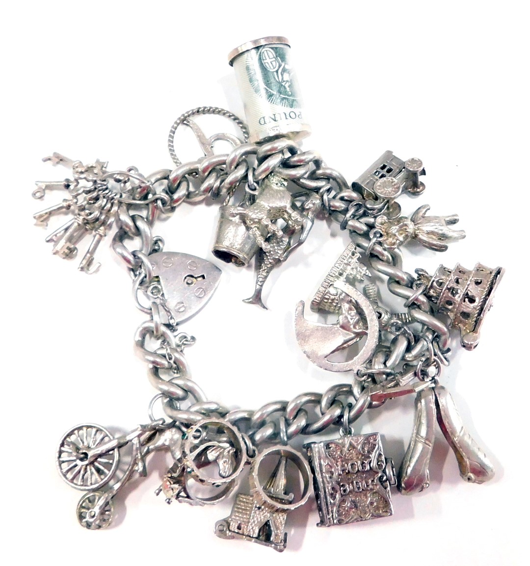 A silver charm bracelet, the curb link bracelet with safety chain and heart shaped padlock stamped s