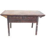 A Chinese red stained altar table, with rectangular planked top above two short drawers, on plain su