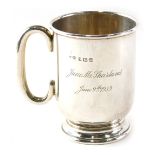 A George V silver christening mug, of plain design, inscribed to 9.5cm high June M Sharland...1935,