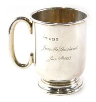 A George V silver christening mug, of plain design, inscribed to 9.5cm high June M Sharland...1935,