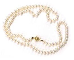 A cultured pearl and crystal necklace, the cultured pearl necklace with orb clasp, yellow metal stam