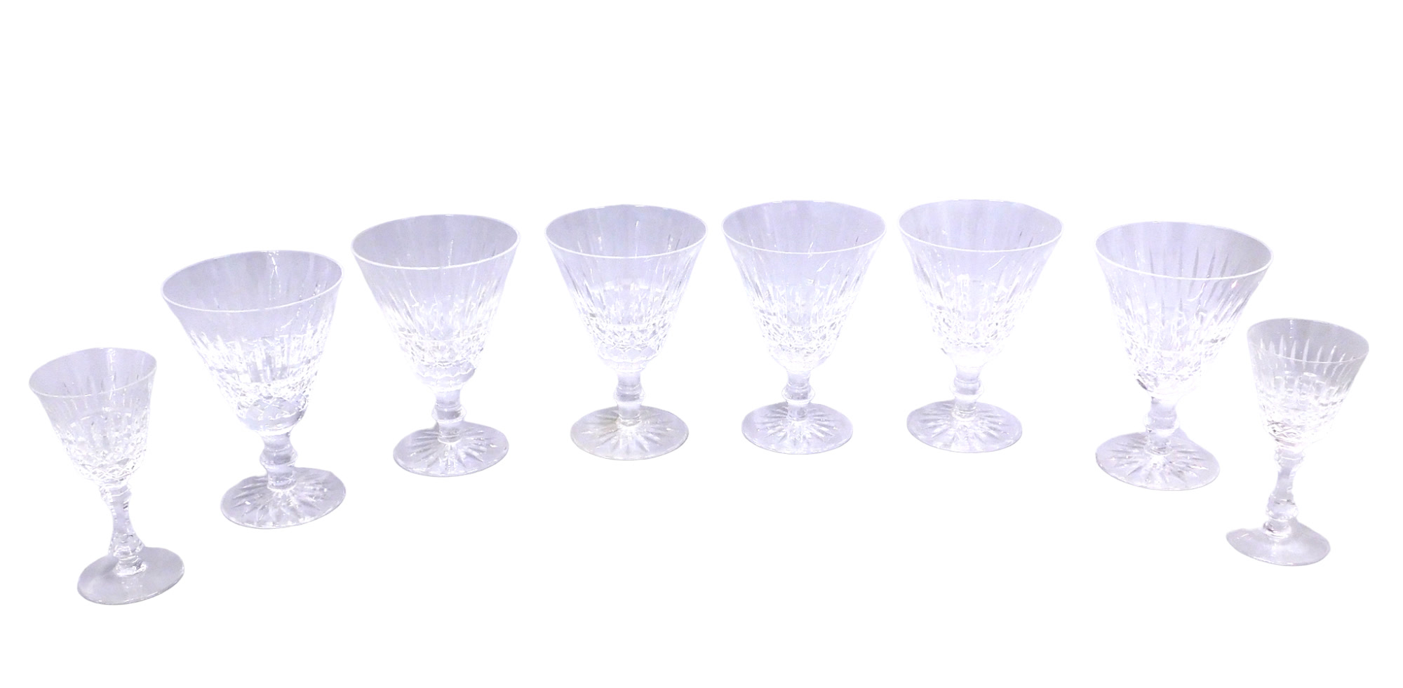 A set of six Waterford wine glasses, each with a cut tapering bowl, 14cm high, and two smaller glass