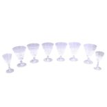 A set of six Waterford wine glasses, each with a cut tapering bowl, 14cm high, and two smaller glass