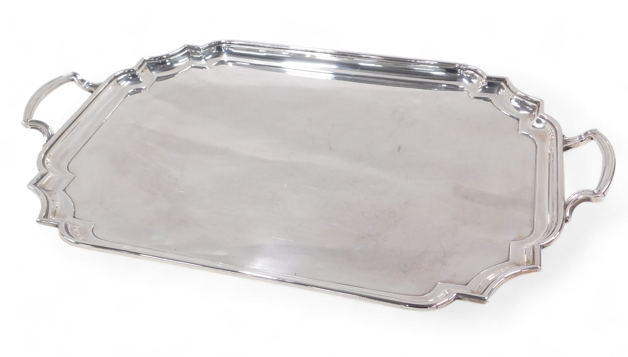 An Elizabeth II heavy silver two-handled tray, with raised moulded border and inset corners, 61cm, B