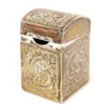 An Edwardian silver miniature playing card box, with domed hinged lid, repousse, scroll and flower h