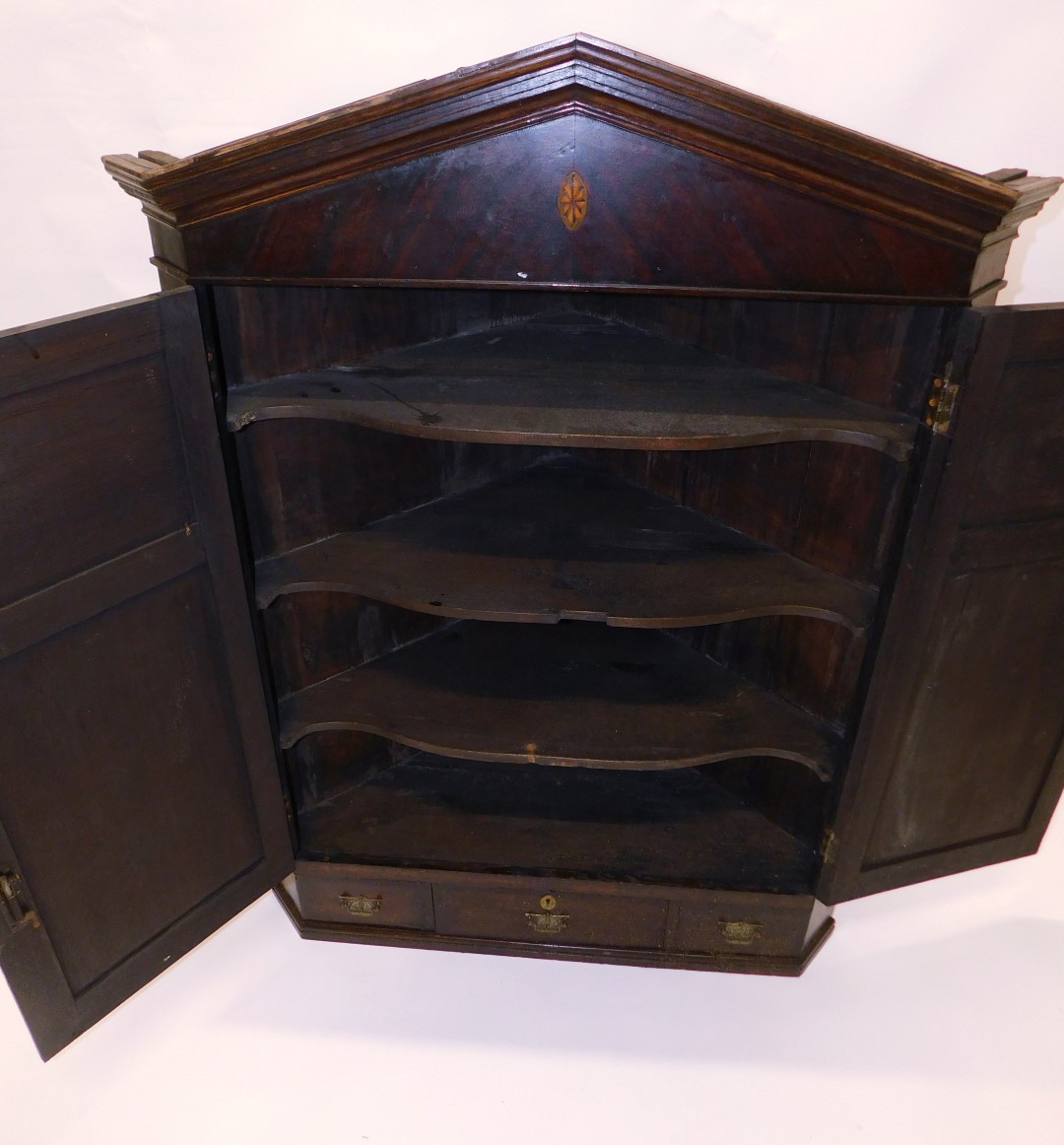 A early 19thC oak and mahogany corner cabinet, the arched cornice above two panelled doors, each lat - Image 3 of 3