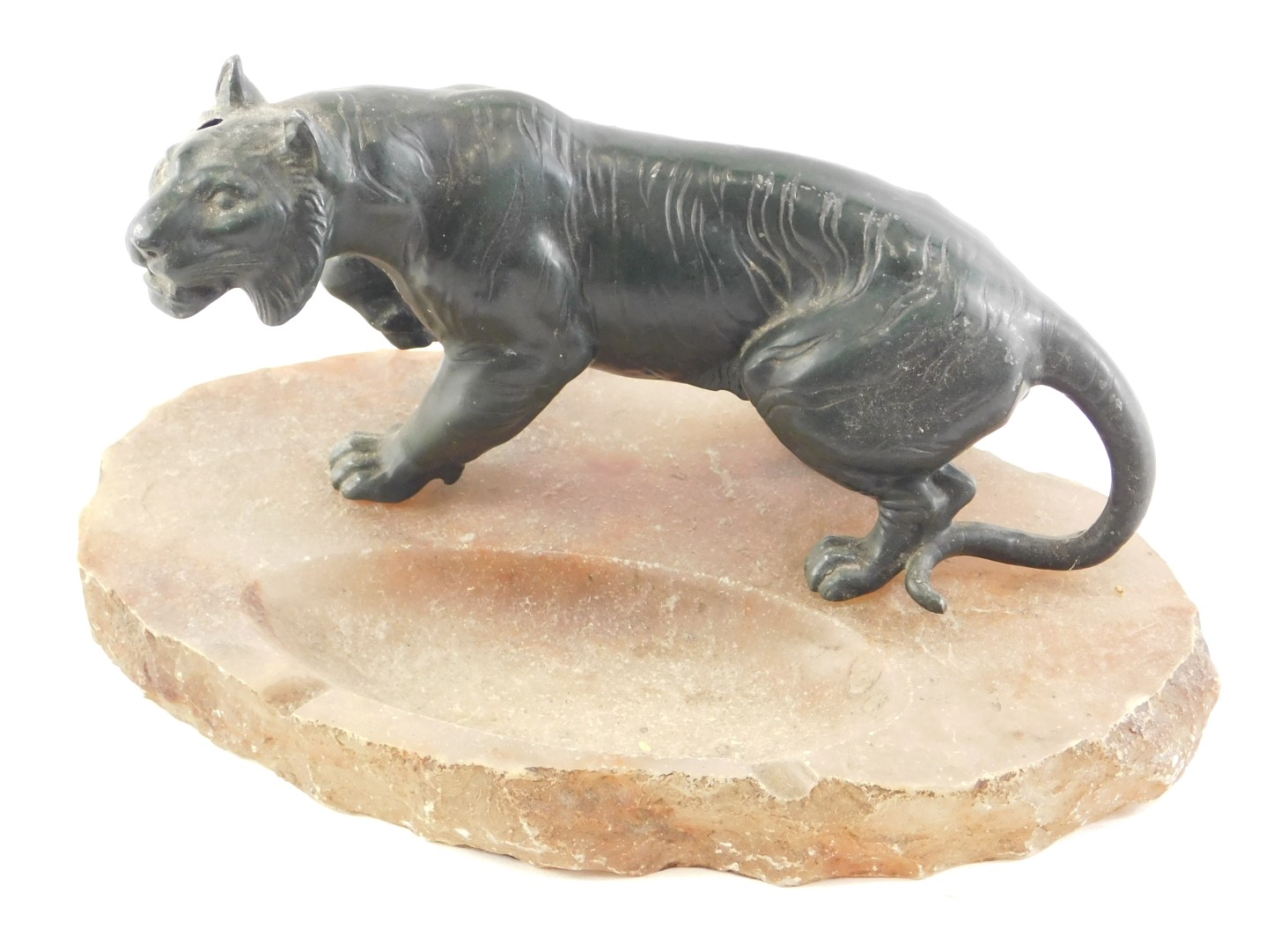 A late 19th/early 20thC Japanese green patinated spelter tiger, mounted on an alabaster ashtray, 27c