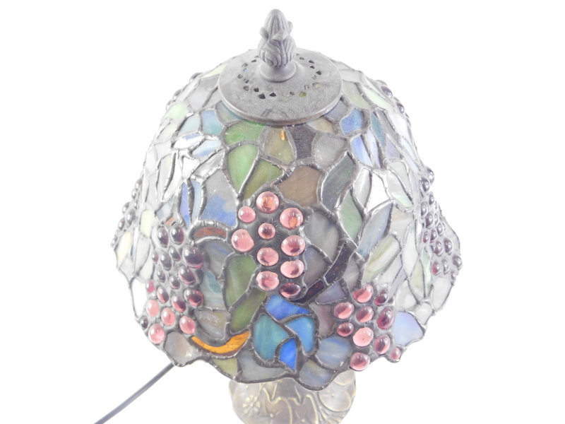 A small Tiffany style lamp, with stained glass shade and bronze effect base, 34cm high. - Image 2 of 2