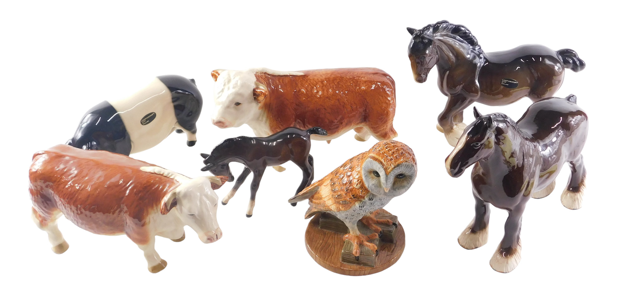 A quantity of ceramic animals and birds, to include Royal Doulton barn animal, Hereford bull, Copper