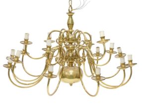 A brass Dutch style twelve branch chandelier, with stylised candle fitting, 100cm wide.