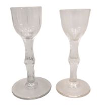 Two similar late 18th/early 19thC liqueur glasses, one with a cut bowl and a faceted stem, the other