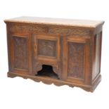 A late 19thC carved oak dresser, the rectangular top with a moulded edge, above two frieze drawers a