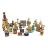A quantity of Wade Whimsies, buildings, a pipe stand, small decanter (lacking contents), etc.