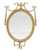 A late 19th/early 20thC oval wall mirror, in Adam style, the frame decorated with swags and leaves,
