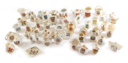 A large quantity of crested china, to include various jugs, swan, harp, a City of Lincoln vase, barr