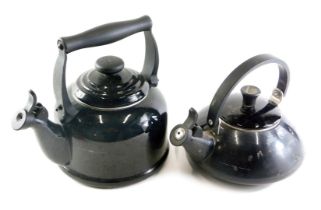 A Le Crueset black enamelled stove kettle, 1.5ltr, and another larger example, 2.1ltr. (2) Buyer No
