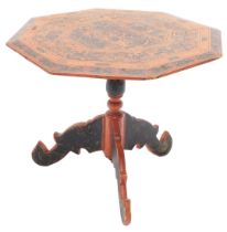 An Oriental black and red laquered occasional table, the hexagonal top on a turned column, and tripo