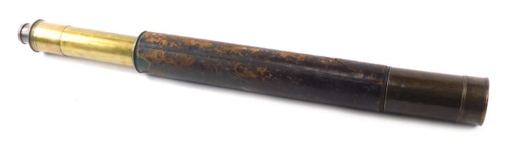 A brass and leather telescope, 42cm long. (AF)