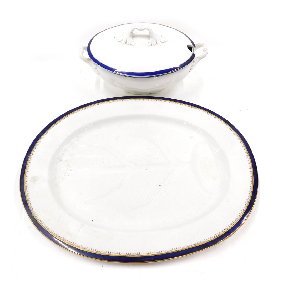 A Meakin white and blue glazed tureen and cover, with two handles, 24cm wide, and a similar meat dis