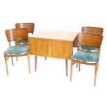A 1950s/60s walnut drop leaf table, on square tapering legs, and four chairs, each with a drop in se
