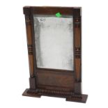 A 19thC mahogany overmantle mirror, the inverted break front cornice with a gadrooned border, the re