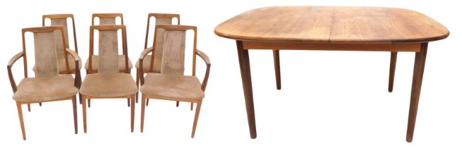 An extending teak dining table, with rectangular top with rounded corners, on turned tapering legs,
