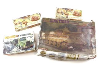 A collection of model kits, two Airfix RAF emergency sets, Matchbox tank transporter, and tank.