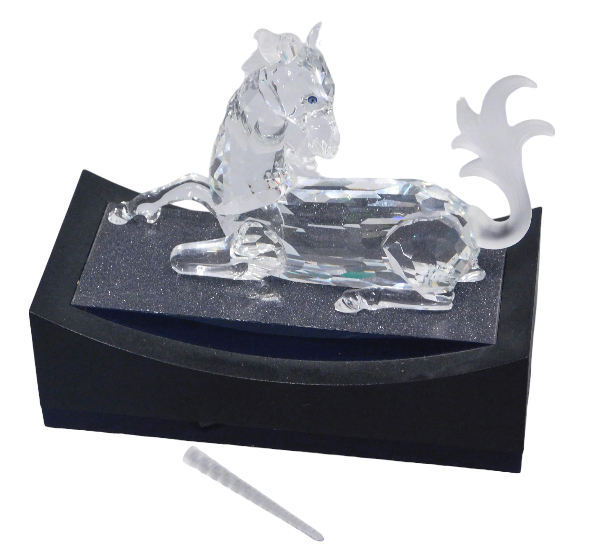 A Swarovski crystal Fabulous Creatures seated unicorn 1996, 11cm high, boxed, with display stand. (A