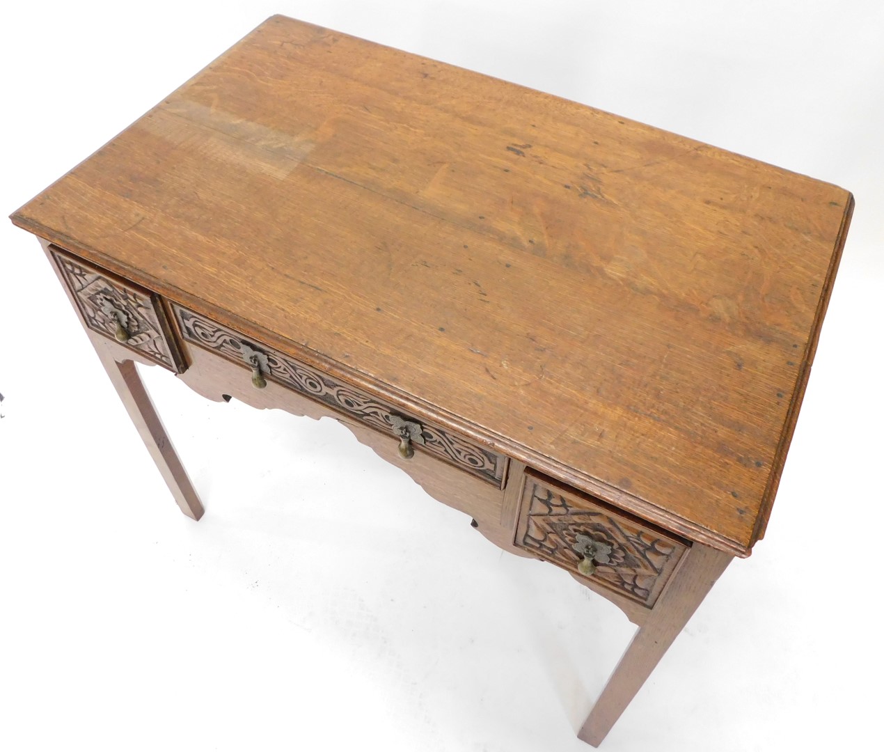 An early 19thC oak lowboy, the rectangular top with a moulded edge above three later carved drawers, - Image 2 of 2