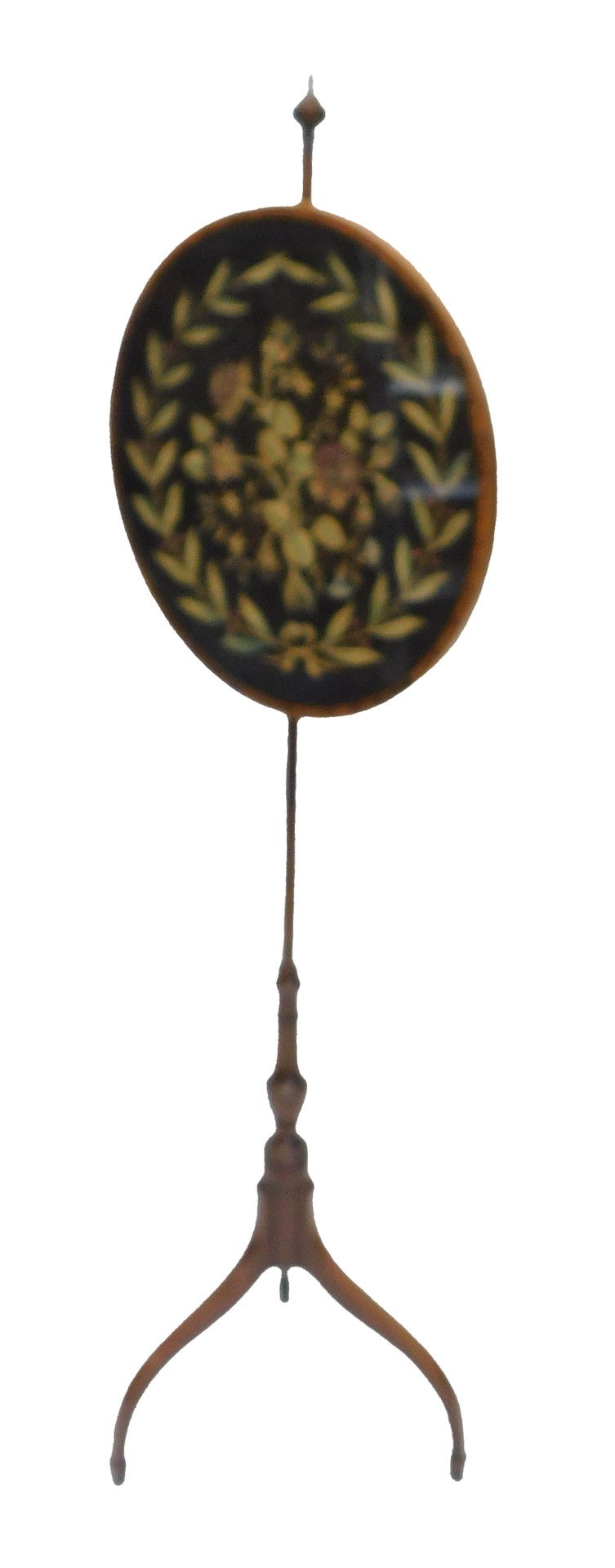 A 19thC mahogany pole screen, the oval banner embroidered in silk with leaves, berries surrounding a