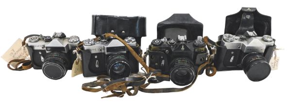 A Zenit-E camera, and three other Zenit cameras.