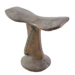 Tribal Art. An African carved wooden headrest, the domed foot with rivet repair, 21cm wide.