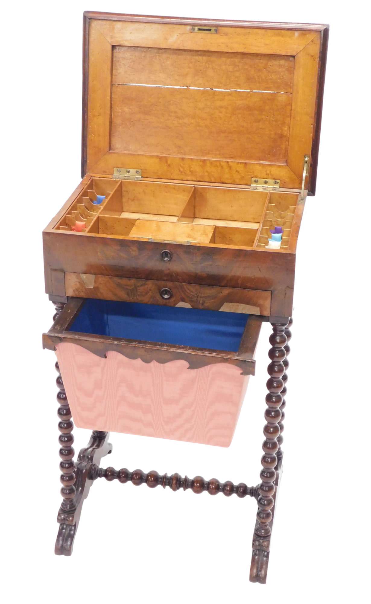 A 19thC mahogany work table, the hinged lid enclosing a maple veneered interior, above a drawer and