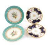 A pair of Coalport side plates, each decorated with flower sprays on a cobalt blue ground with gilt
