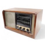 A walnut valve radio, with Bakelite fittings, 44cm wide.