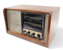 A walnut valve radio, with Bakelite fittings, 44cm wide.