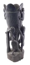An African tribal carved vase, decorated with figures, ostrich, etc., 48cm high.