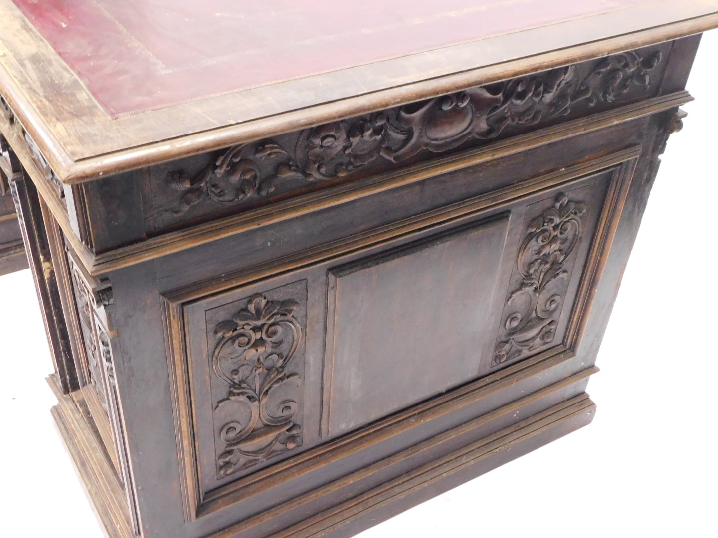 A Continental carved oak pedestal desk, the rectangular top with an ox blood red leatherette inset, - Image 4 of 6