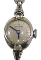 A Bulova stainless steel cased ladies wristwatch, the oval watch head, with a silvered dial and blue