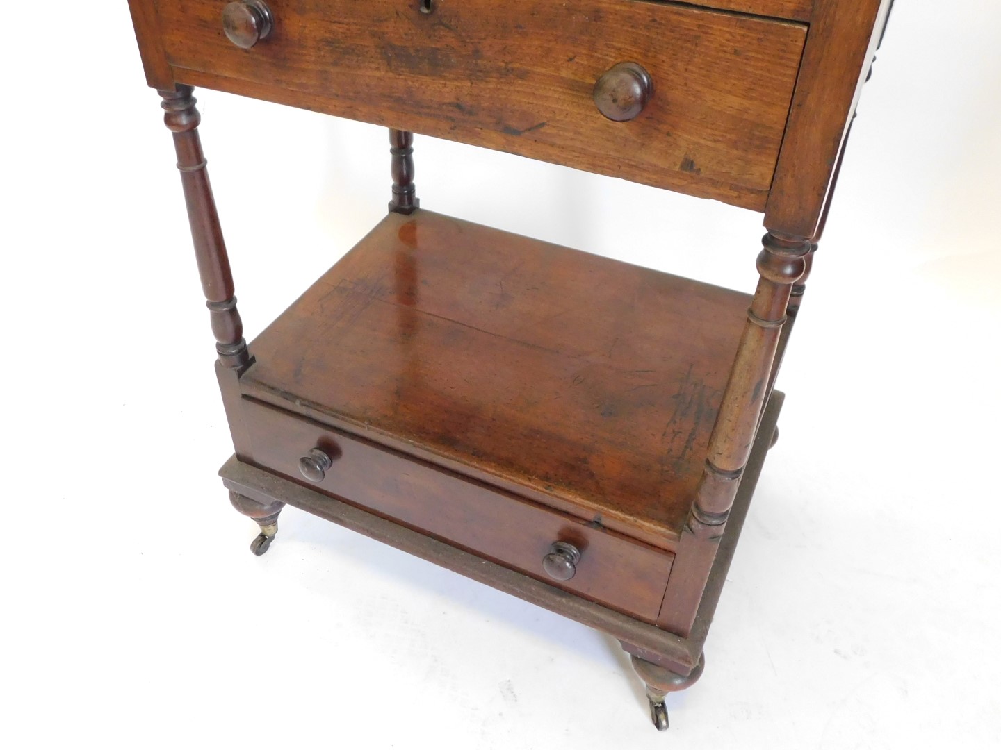 A 19thC mahogany three tier whatnot, with two drawers, on bun feet with ceramic castors, 120cm high, - Image 3 of 3