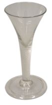 An 18thC wine glass, with tapering bowl and air twist stem, fold over domed foot, 18cm high.