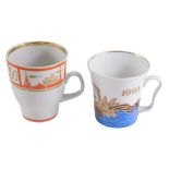 Two USSR porcelain mugs, comprising one stamped 1945-1998, 9.5cm high, and a mug with orange and gol