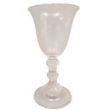 A late 18th/early 19thC wine glass, with a bell shaped bowl and triple air twist knopped stem, fold